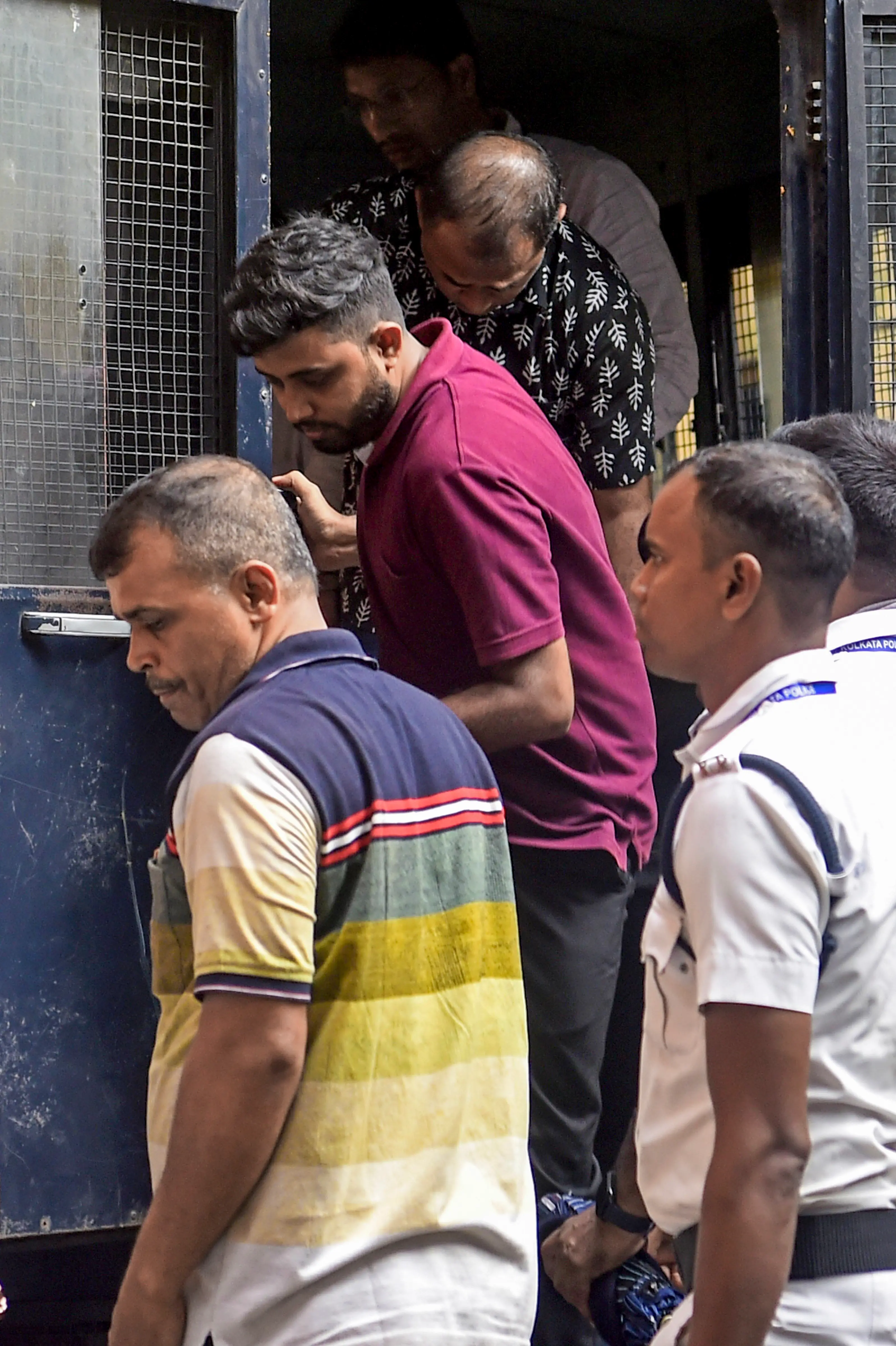 Police personnel produce people at City Court, arrested in alleged connection with the Chorbagan Puja pandal stampede, in Kolkata on Sunday, Oct 18, 2026 | Photo: PTI