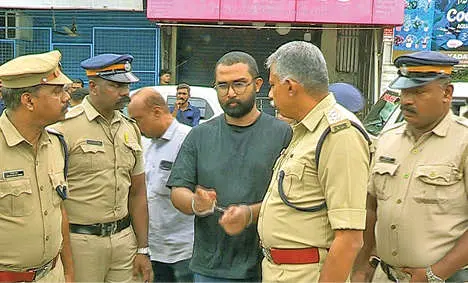 Ebin Paul, arrested in connection with the arson attack outside the Kadavumbhagam Synagogue in Ernakulam, being taken to the synagogue for evidence collection on Sunday.