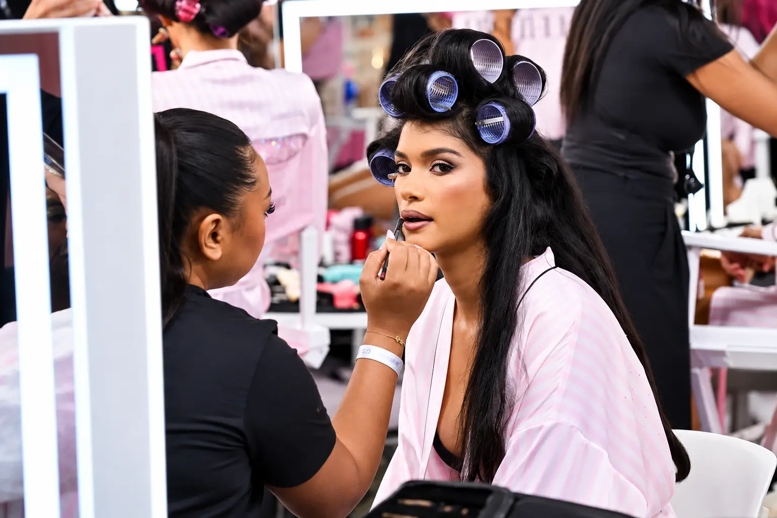 Malayali model Ravleen Varghese gets her makeup done backstage ahead of her Victoria's Secret Fashion Show debut in Los Angeles.