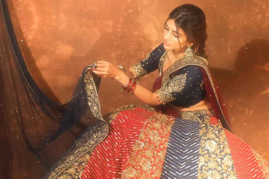 Sreeleela exudes grace in a crimson and indigo lehenga with Ajrakh prints and intricate Aari work | Pictures