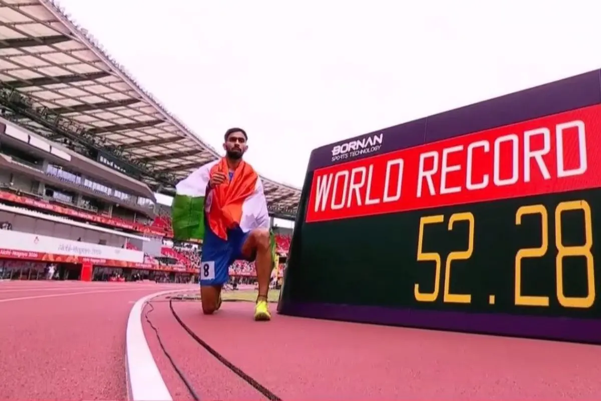 India's Sandeep poses for a photograph after winning a gold medal in the men's 400m T64 final event, with a world-record time of 52.28 seconds, during the ongoing 5th Asian Para Games, in Nagoya, Japan. | Screengrab/Doordarshan Sports