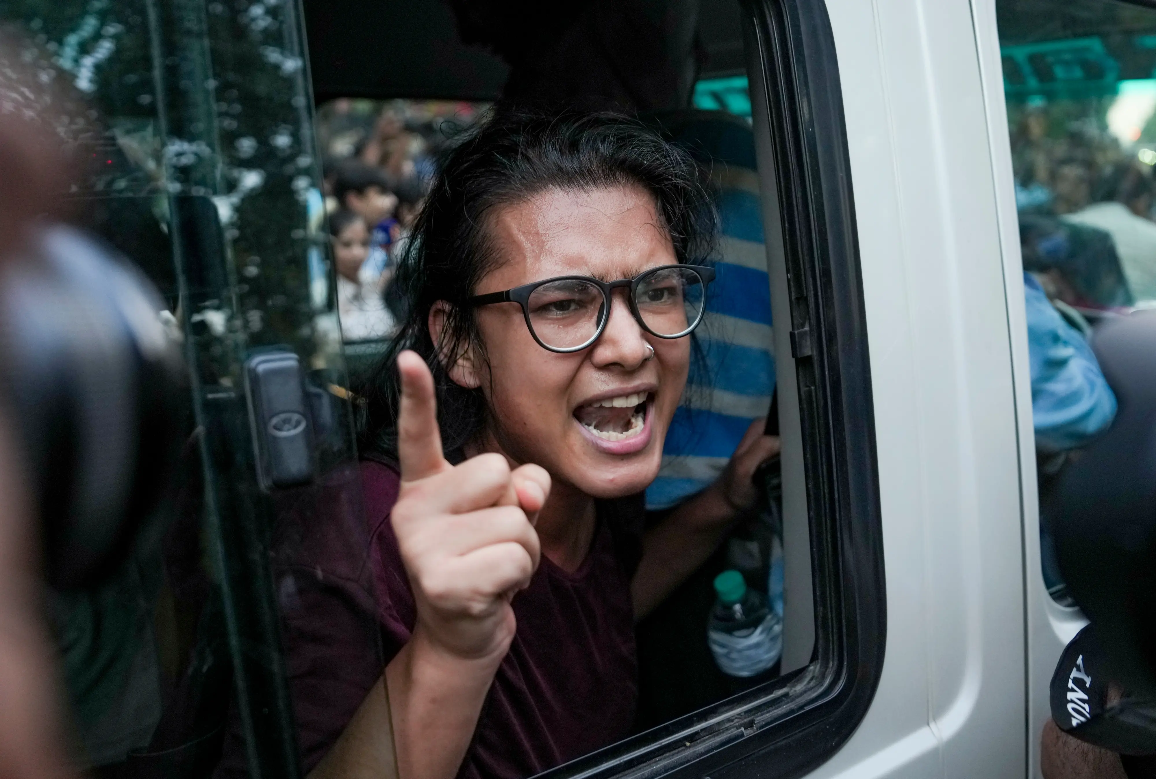 AISA chief Neha Bora speaks to the media after her detention by the police during a protest against Chief Election Commissioner (CEC) Gyanesh Kumar, demanding his resignation over alleged irregularities in the Special Intensive Revision (SIR) of electoral rolls, at Mandi House, in New Delhi.| Photo: PTI