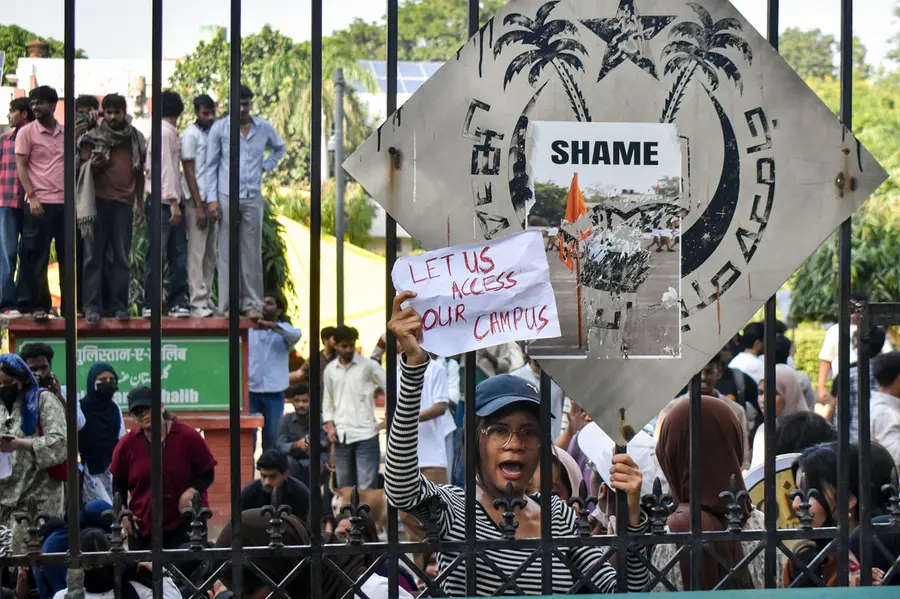 Students stage a demonstration outside the Jamia Millia Islamia University in New Delhi