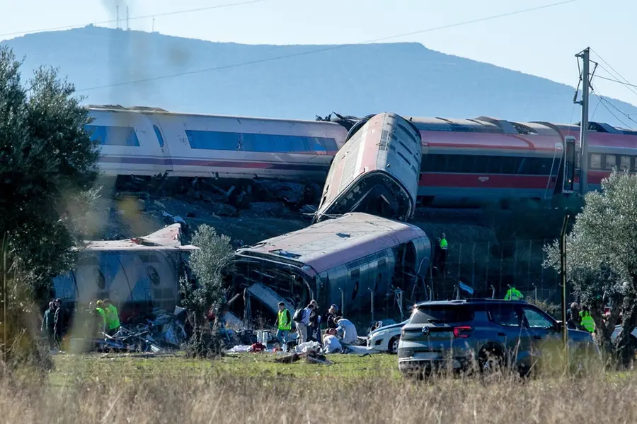 Emergency services attend to the victims at the scene of a collision between two trains in Urda, Spain, on Wednesday