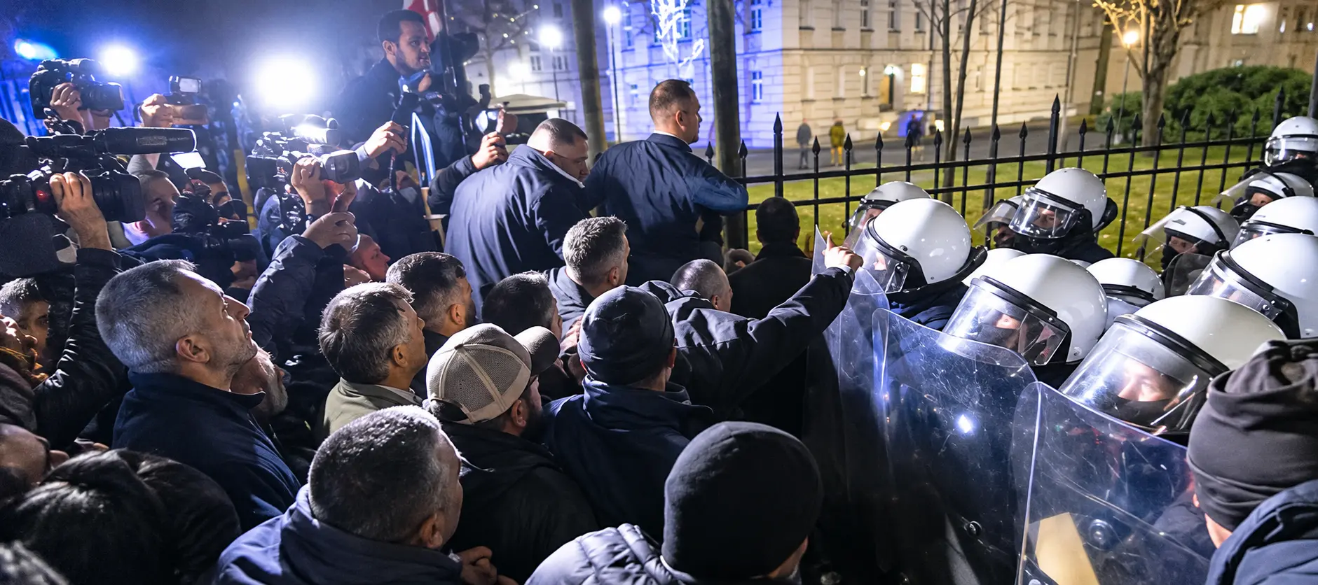 Protesters confront riot police outside Poland's Constitutional Tribunal in Warsaw amid escalating tensions over the suspension of two senior judges.