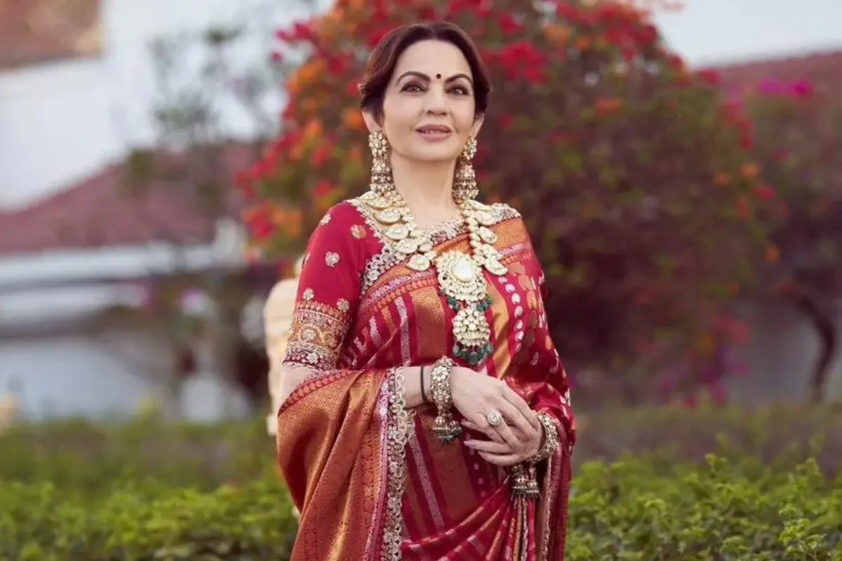 Nita Ambani's vermilion Banarasi saree makes a striking festive statement. Photo | X